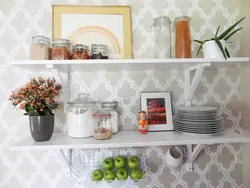 Shelves on the wall in the kitchen above the table photo