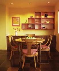 Shelves on the wall in the kitchen above the table photo