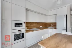 Kitchen white top wooden bottom with white countertop photo