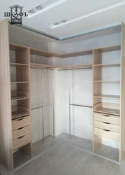 Corner built-in wardrobe in the bedroom inside photo