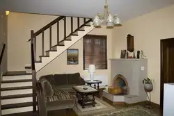 Living room design with stairs to the second floor photo
