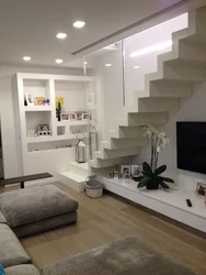 Living room design with stairs to the second floor photo