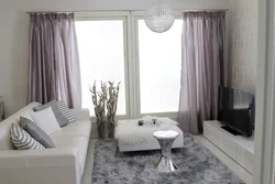 Gray walls in the living room interior, what kind of curtains photo