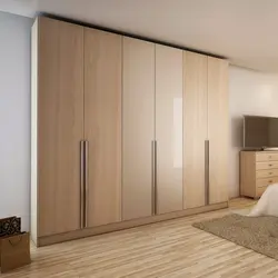 Built-in wardrobe with hinged doors in the bedroom photo