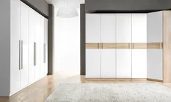 Built-in wardrobe with hinged doors in the bedroom photo