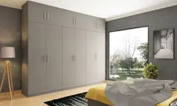 Built-In Wardrobe With Hinged Doors In The Bedroom Photo