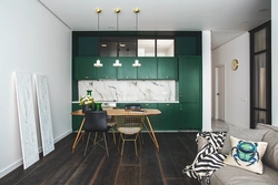 Green Kitchen In The Interior With Living Room Design
