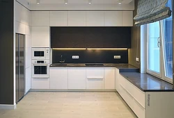Photo Of A Modern Kitchen With Built-In Appliances In An Apartment