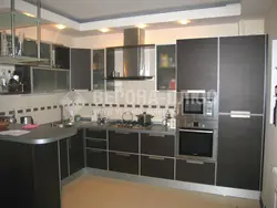 Photo of a modern kitchen with built-in appliances in an apartment