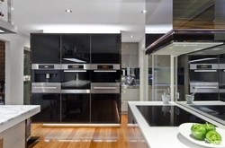 Photo of a modern kitchen with built-in appliances in an apartment