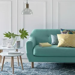 Mint-colored sofa in the living room interior