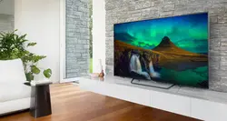 Телевизор 65 дюймов в гостиной фото