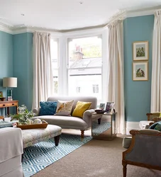 Living room in beige and blue tones design