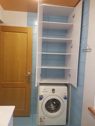 Shelves in the bathroom above the washing machine photo