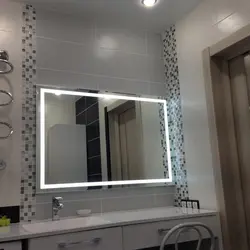 Bathroom mirror with lighting in the bathroom interior