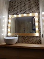 Bathroom mirror with lighting in the bathroom interior