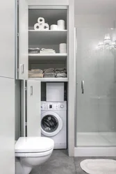 Built-in washing machine in the bathroom in the closet photo