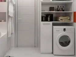 Убудаваная пральная машына ў ваннай у шафу фота