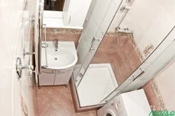 Photo Of A Small Bathroom With Shower And Washing Machine