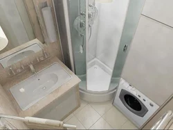 Photo of a small bathroom with shower and washing machine