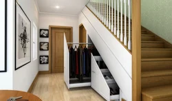 Photo of dressing room design under the stairs