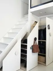 Photo of dressing room design under the stairs