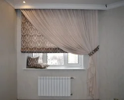 Roman Blinds In The Kitchen Interior With Tulle