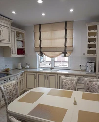 Roman Blinds In The Kitchen Interior With Tulle