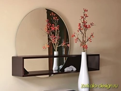 Wall mirror for hallway with shelf photo
