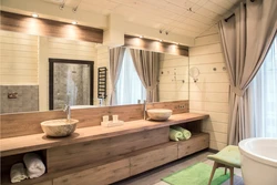 Interior of a bathroom in a wooden house made of logs