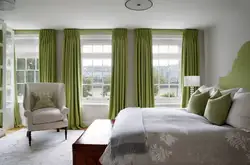 Curtains under gray walls in the living room interior