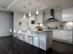Kitchen with gray walls and white furniture photo