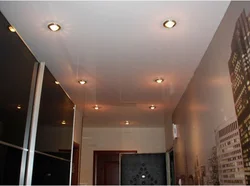 Lamps on a suspended ceiling in the hallway interior photo