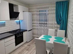 Turquoise color of curtains in the kitchen photo