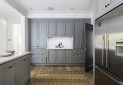 Photo of a gray kitchen combined with white