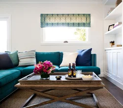 Photo of a living room with a sea-green sofa