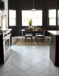 Floor design in the living room kitchen made of porcelain stoneware photo