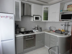Furnishings of a small kitchen with a refrigerator photo