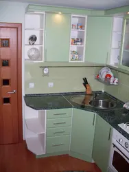Furnishings of a small kitchen with a refrigerator photo