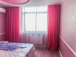 Interior of curtains in the bedroom with pink wallpaper