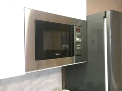 Kitchen with built-in microwave photo