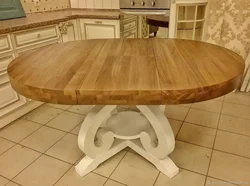 Round wooden table in the kitchen interior