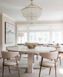 Round wooden table in the kitchen interior