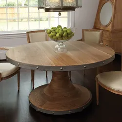 Round Wooden Table In The Kitchen Interior