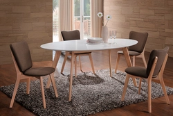 Round wooden table in the kitchen interior