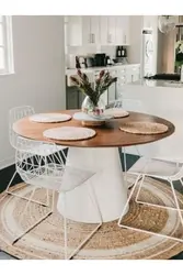 Round wooden table in the kitchen interior