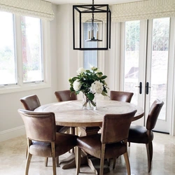 Round wooden table in the kitchen interior