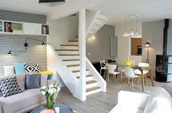 Kitchens in a room with stairs photo