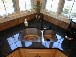 Corner sink in the kitchen in the interior