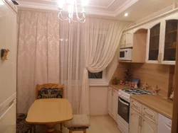 Beige kitchen curtains in the interior